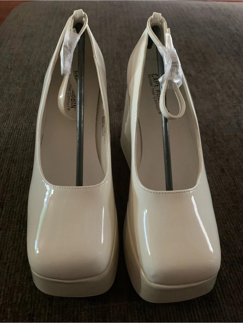 Cape Robbin platform heels feature a square toe design and a patent finish.